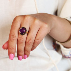 Bague dorée pierre violette...