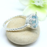 Bague argent griffée pierre topaze bleue
